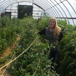 woman farmer in hoop house-carlsons-island-view-orchard_2022 grantee