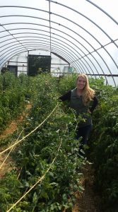 woman farmer in hoop house-carlsons-island-view-orchard_2022 grantee