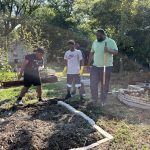 Kids and staff prepare new growing beds at Sankofa Way Youth Garden