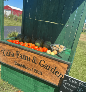 Farm stand with produce on display.