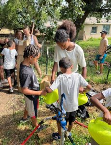 Kids helping plant in the garden